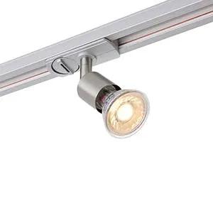 Modern LED track light in brushed metal finish mounted on a ceiling rail