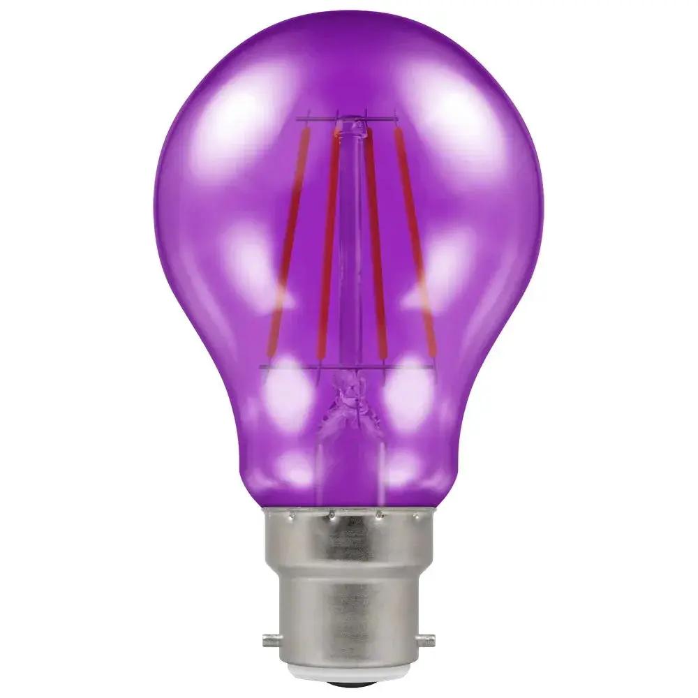 Purple LED filament light bulb with bayonet cap on white background