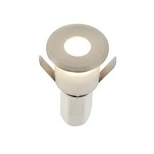 Round LED downlight with brushed metal trim for home or business lighting