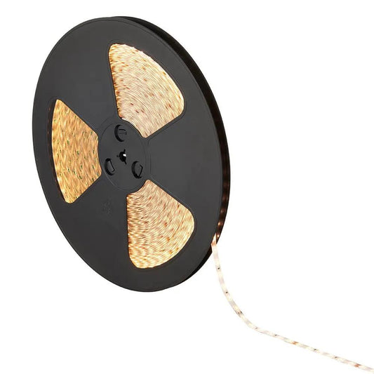 Warm white LED strip light on a black reel for home and commercial lighting