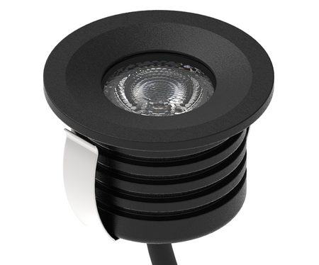 Black recessed LED ground light with round trim and ribbed housing for outdoor lighting